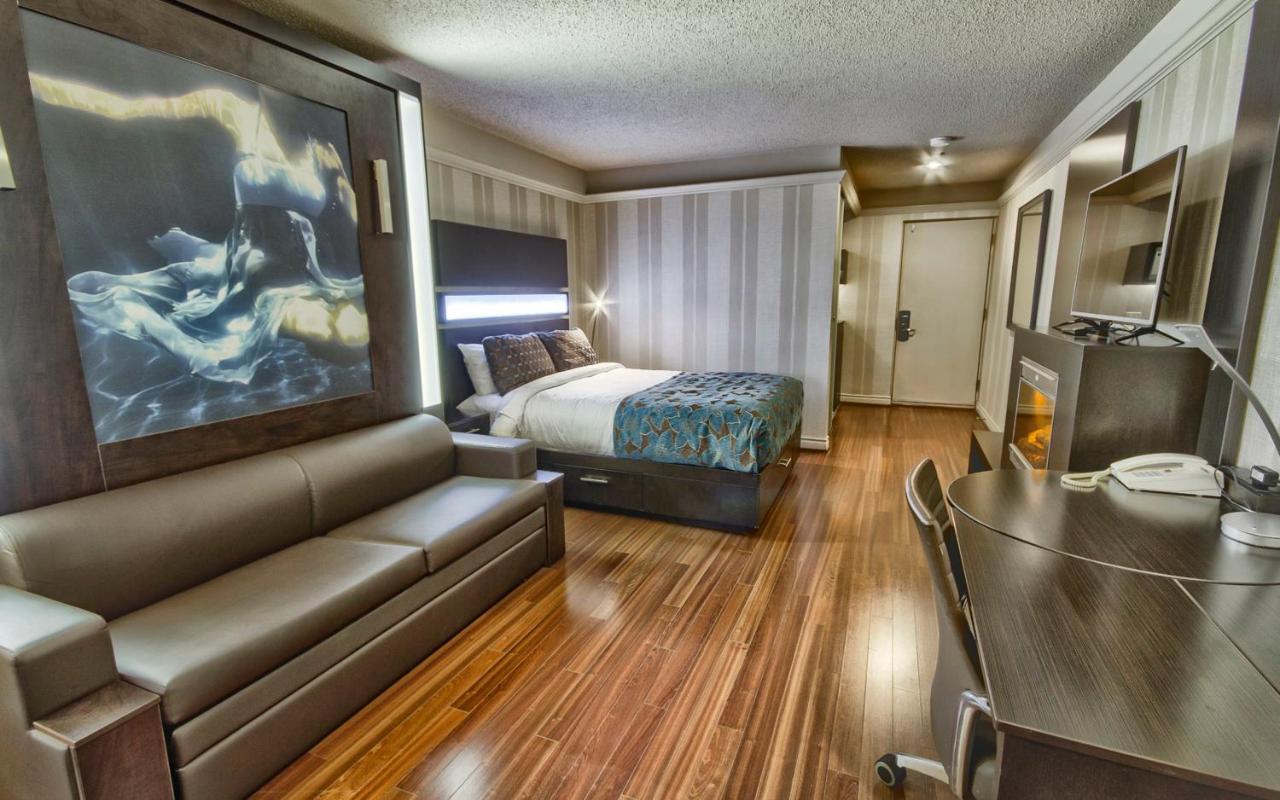 Chambre Moderne avec Lit Queen-Size, Lit Queen-Size Escamotable et Cheminée - Vue sur Intérieur